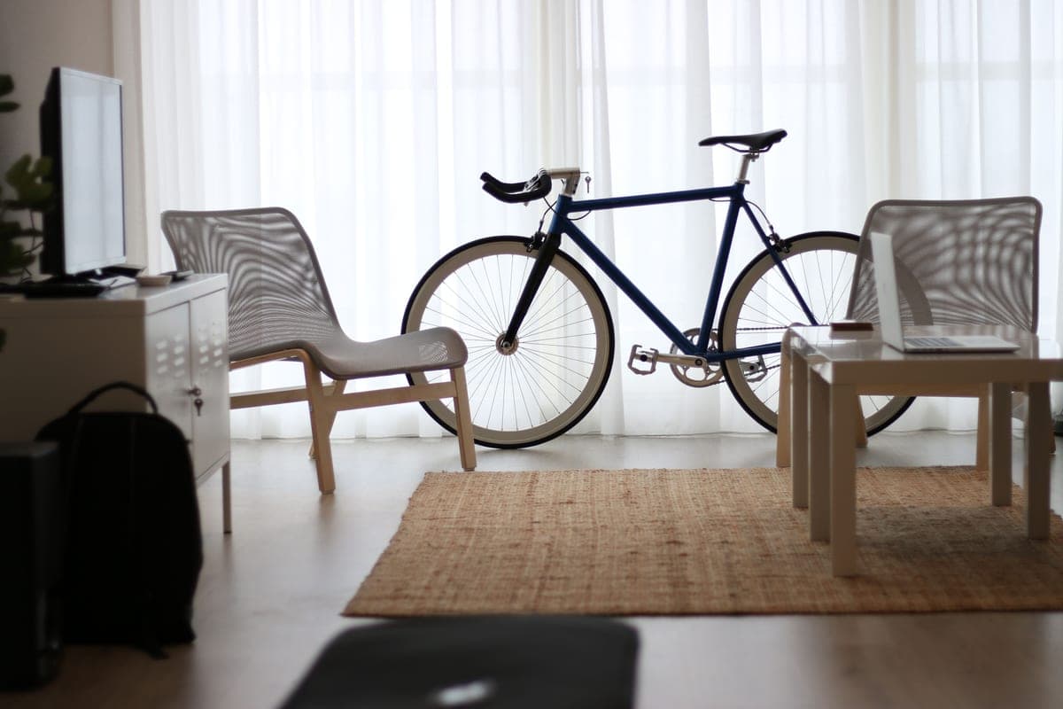 A stationary exercise bike in a bright domestic living room