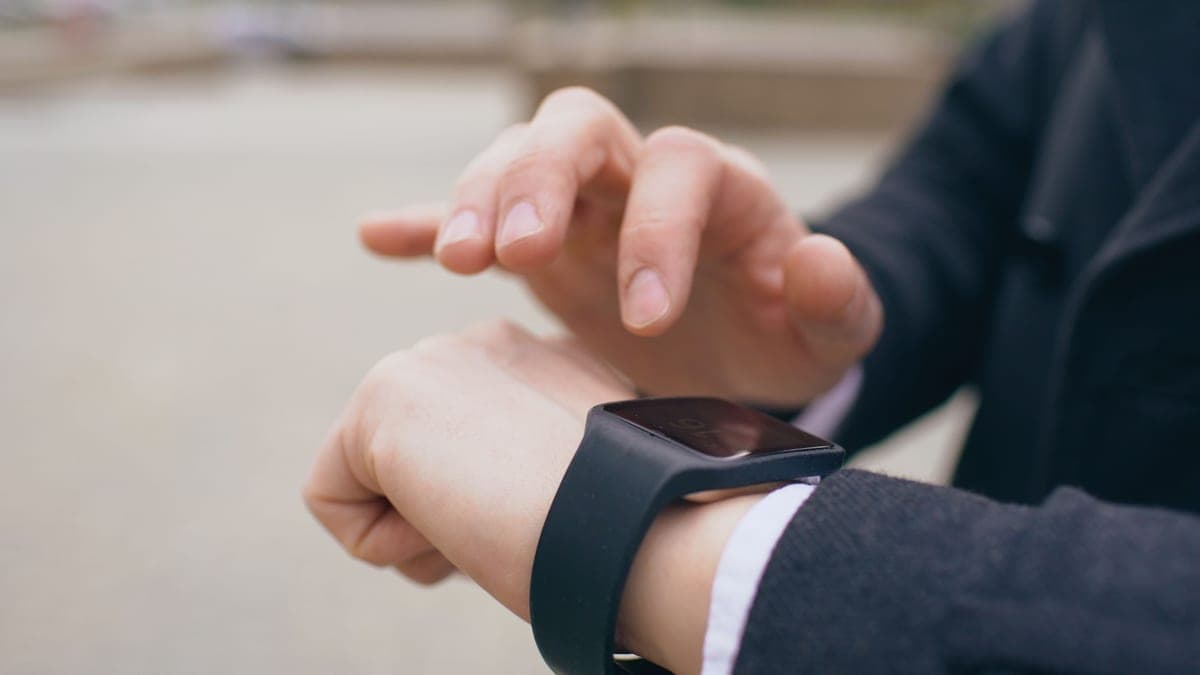 A close view of a simple smartwatch worn on the wrist
